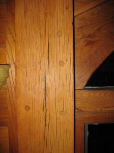 Pegged mortise and tenons joining bracing members to a post.