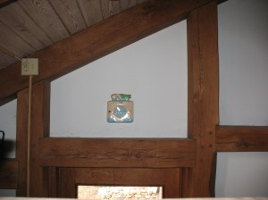 Four pegged and housed mortises and tenons join the lintel and beams to the two posts.  Pegged mortises and tenons join  the posts to the rafter.